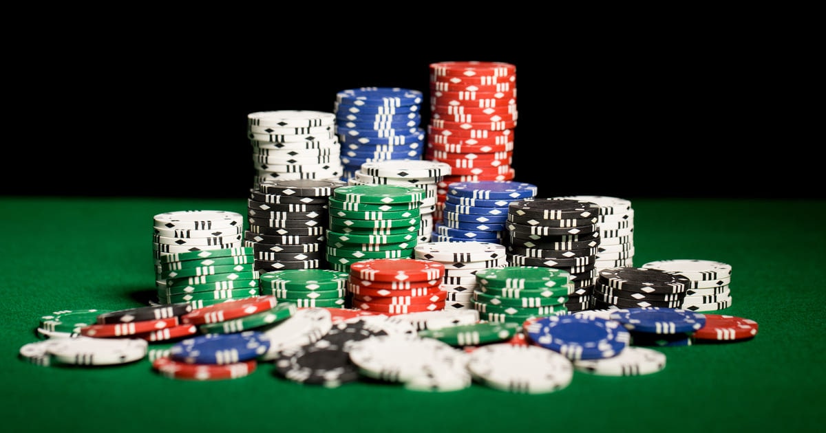 Pile of casino poker chips on a table illustrating jk8 free credit balance before conversion