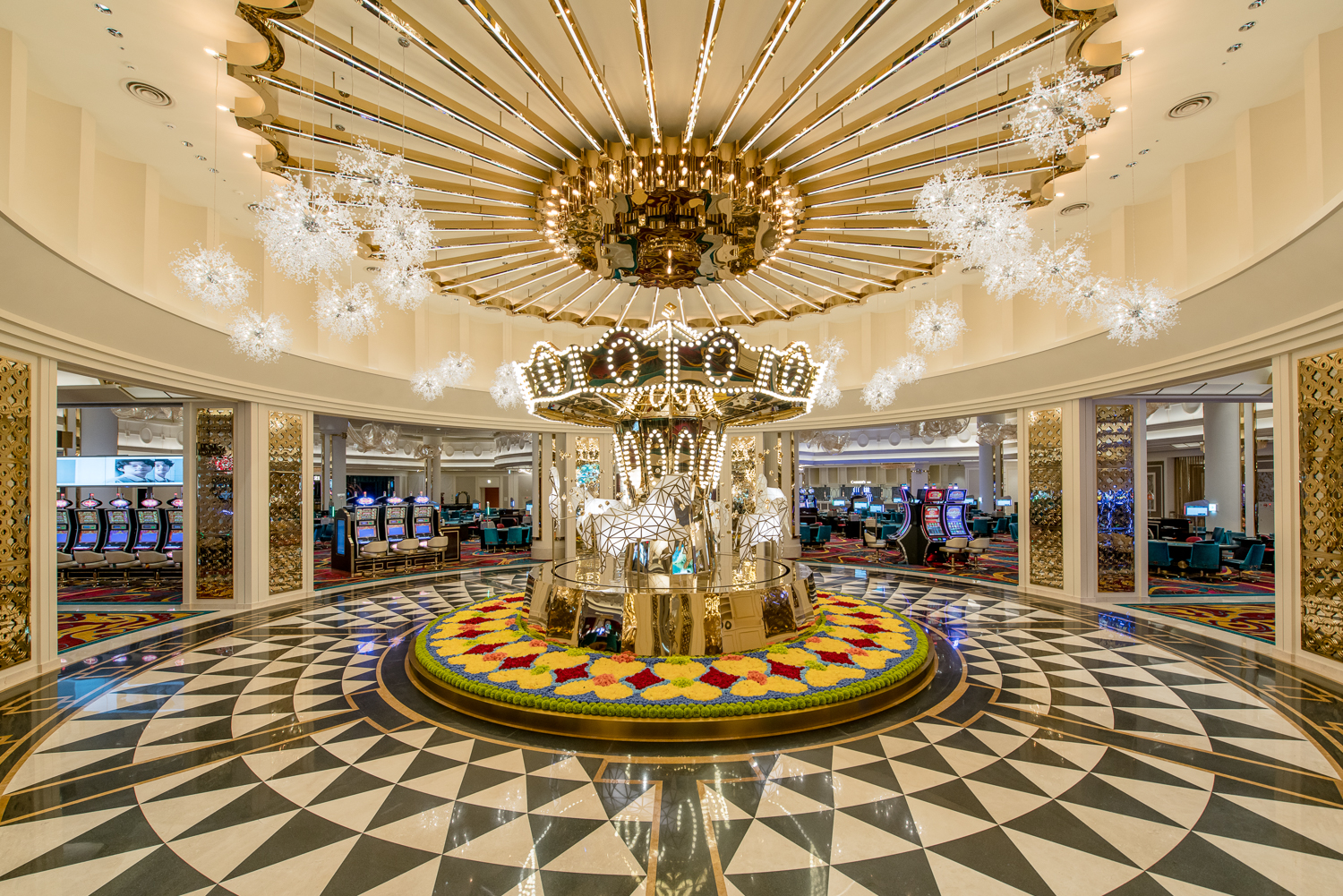 Elegant casino interior featuring a golden chandelier, archways and a green felt table evoking Casino Royale's high-stakes mood