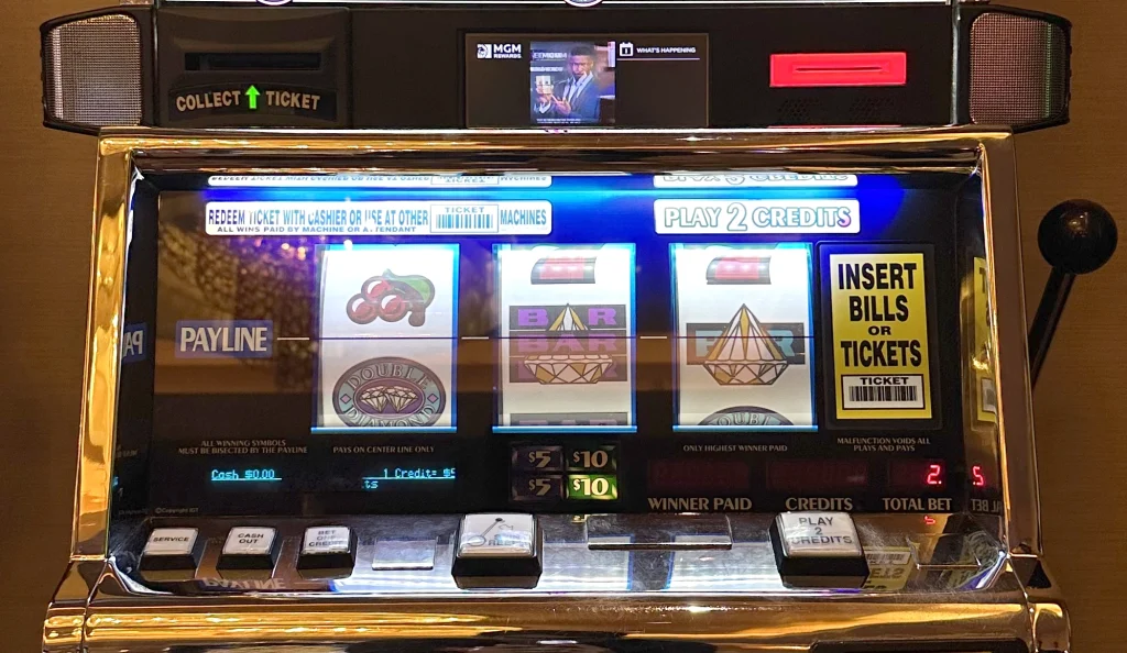 Glowing slot machine display representing jk8 slots eligible for turnover during free credit conversion