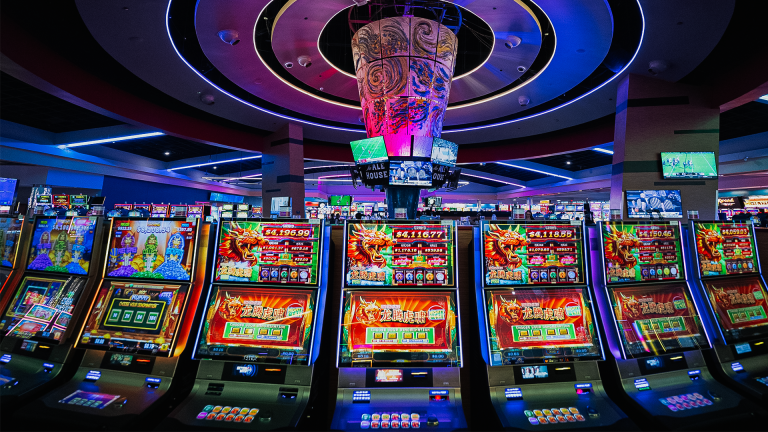 Bright casino slot machine reels showing the games available where Mega888 is located online