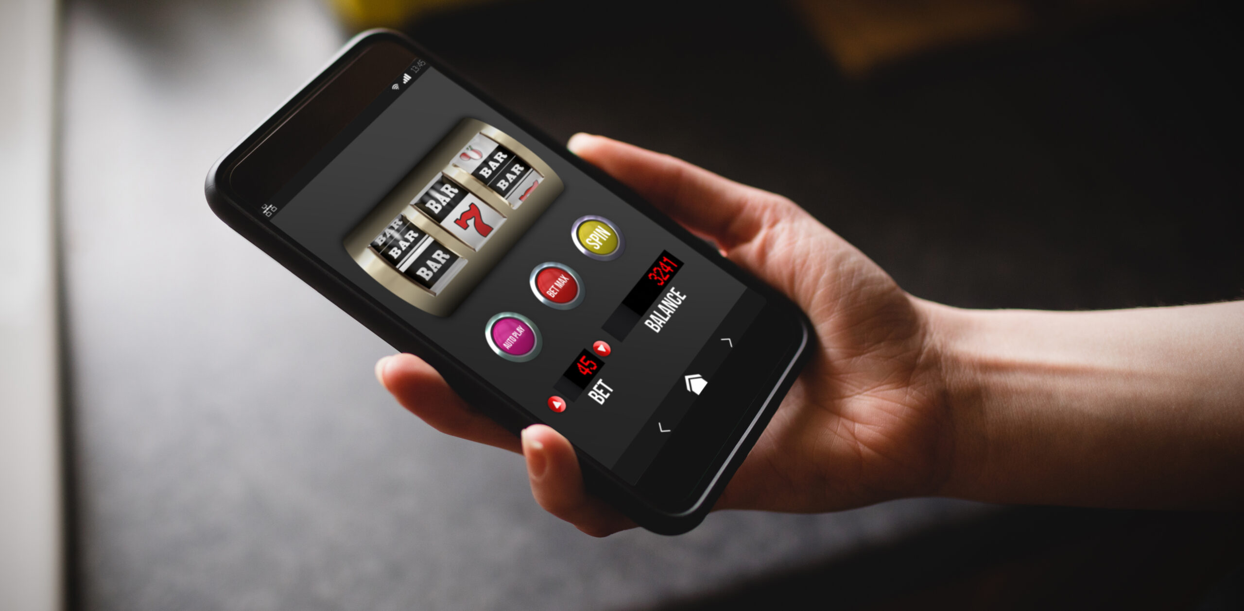 Smartphone showing Golden Pokies mobile slot reels with a spin button and no deposit bonus banner